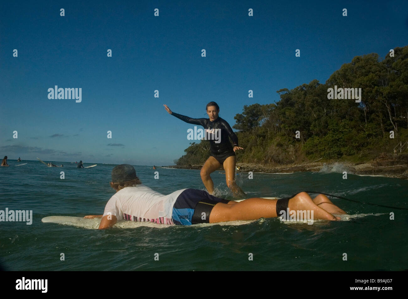beginner surfing Noosa Queensland Stock Photo