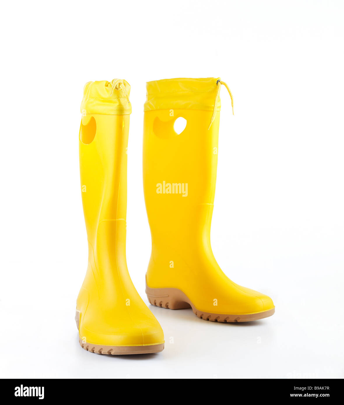 Yellow womens rain boots on white background Stock Photo