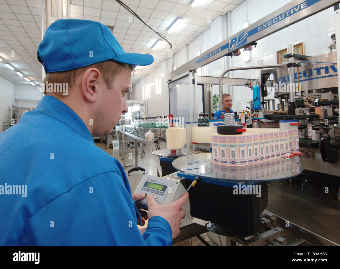 Sticking excise duty stamps on hard drinks at the Ost Aqua Alcoholic