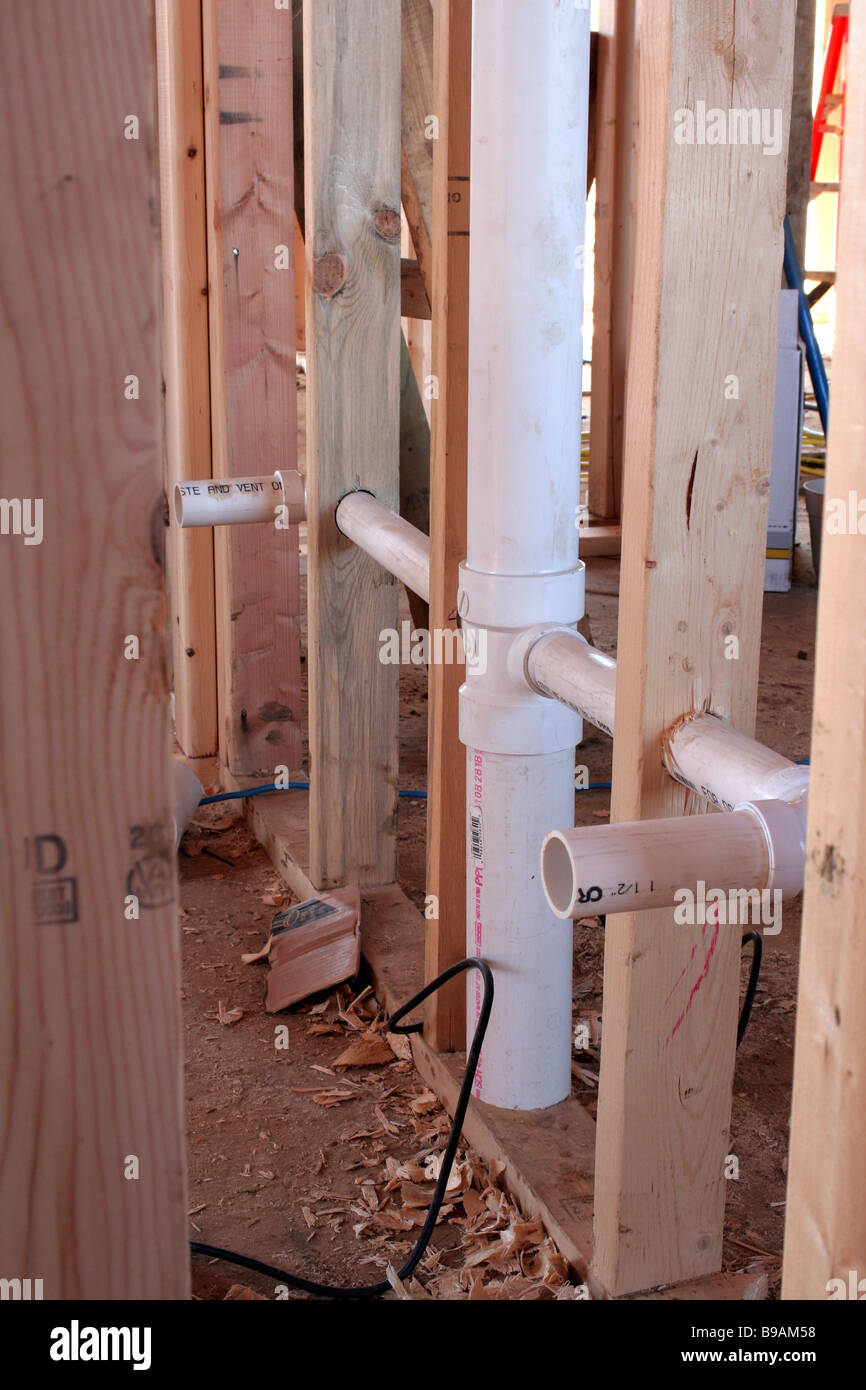 Roughed in plumbing at construction site Stock Photo