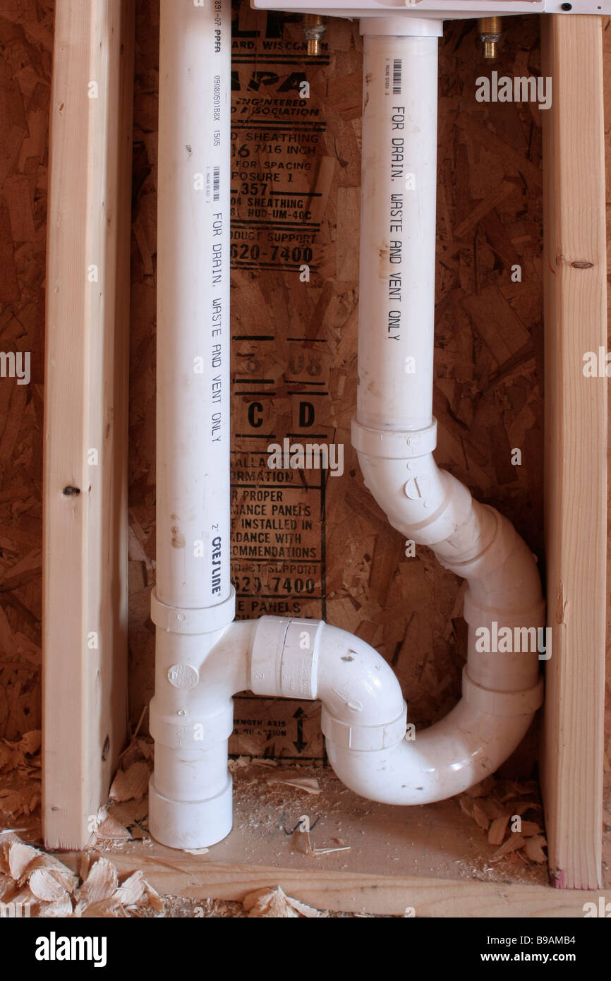 Roughed in drain plumbing in new home construction Stock Photo