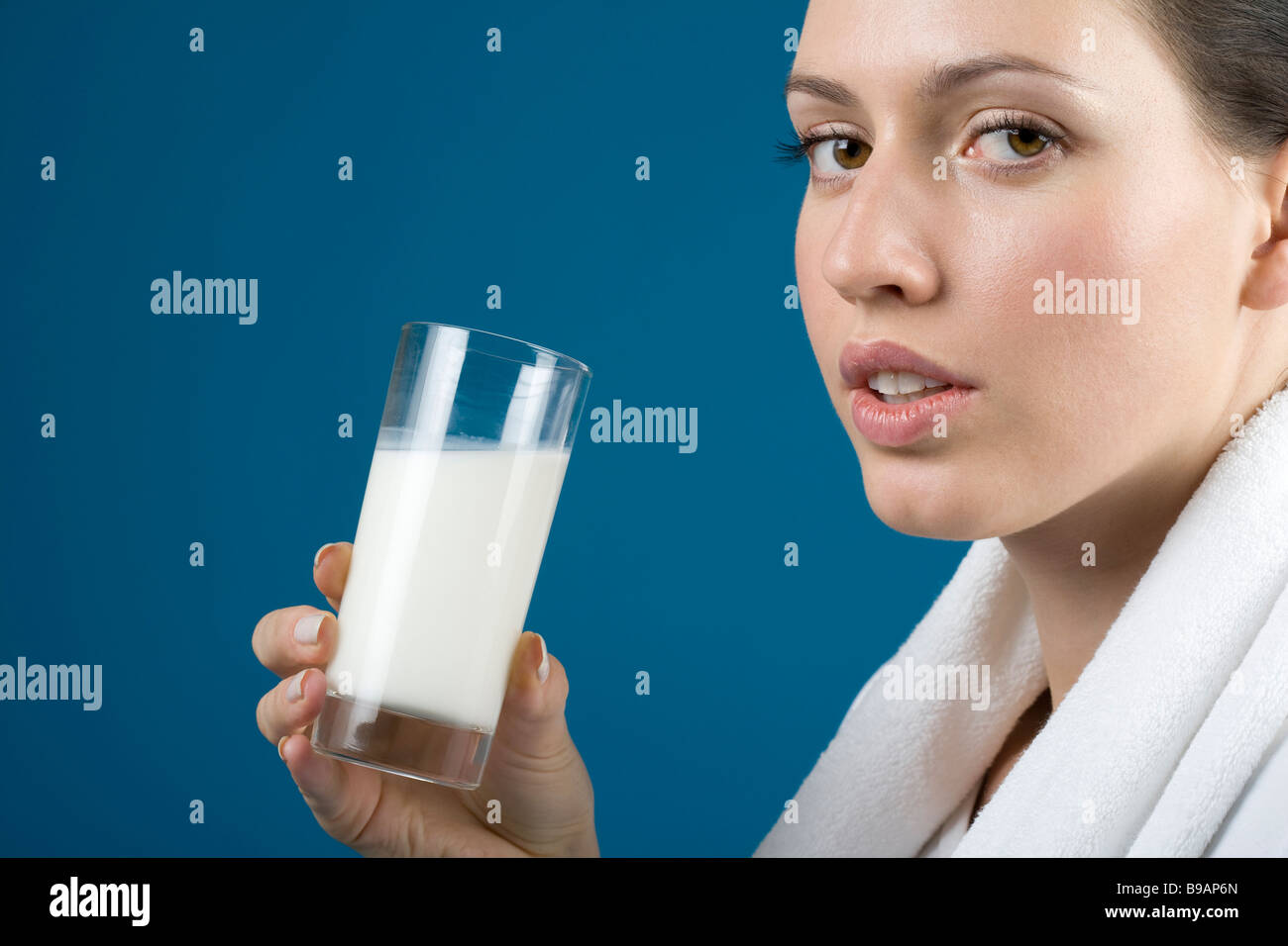 Woman drinking glass of milk Stock Photo Alamy