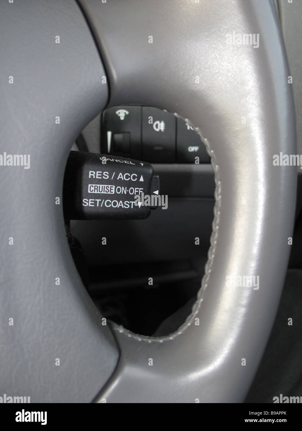 Cruise controls on car steering wheel Stock Photo