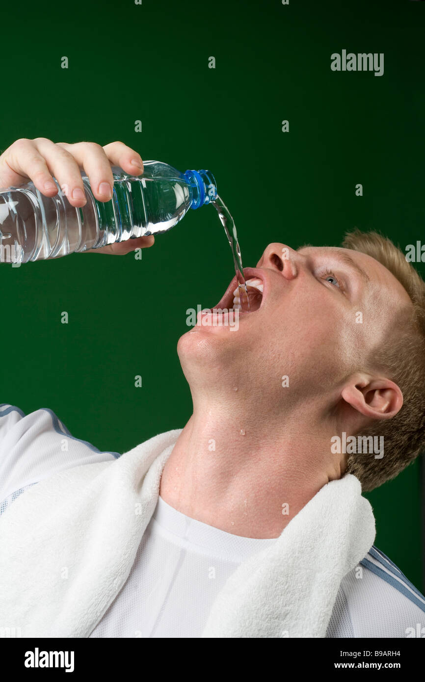 Man drinking from water bottle Stock Photo Alamy