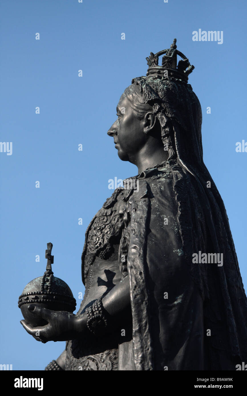 bronze statue of Queen Victoria was designed and executed by Sir Edgar Boehm. It was erected in 1887 in celebration of the queen Stock Photo