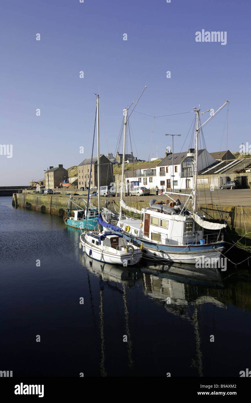 Boats in the harbour of the small village of Burghead on the Moray coast of Scotland, UK Stock Photo
