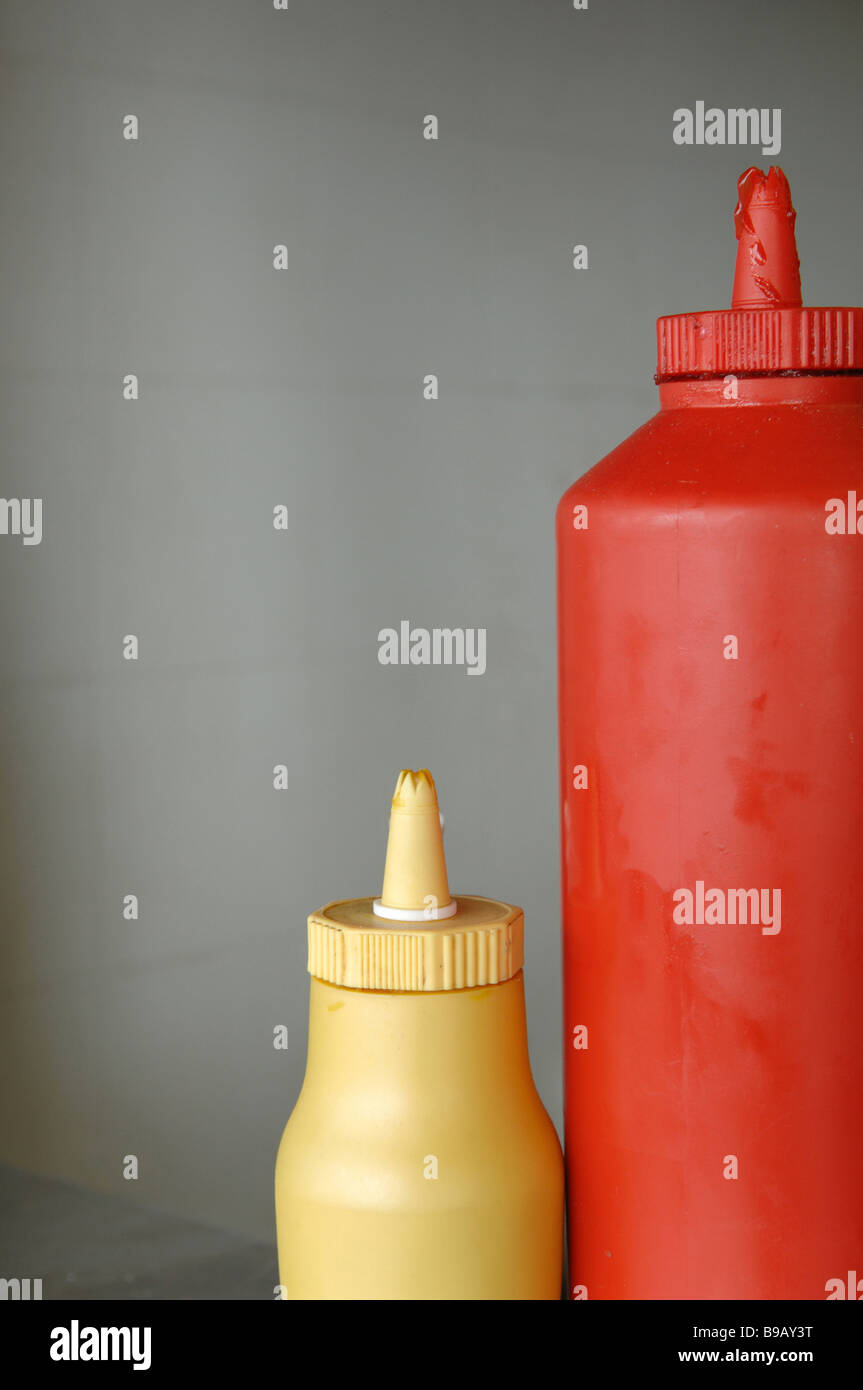 mustard and ketchup sauce on the counter of a food stall or cafe or chip shop Stock Photo