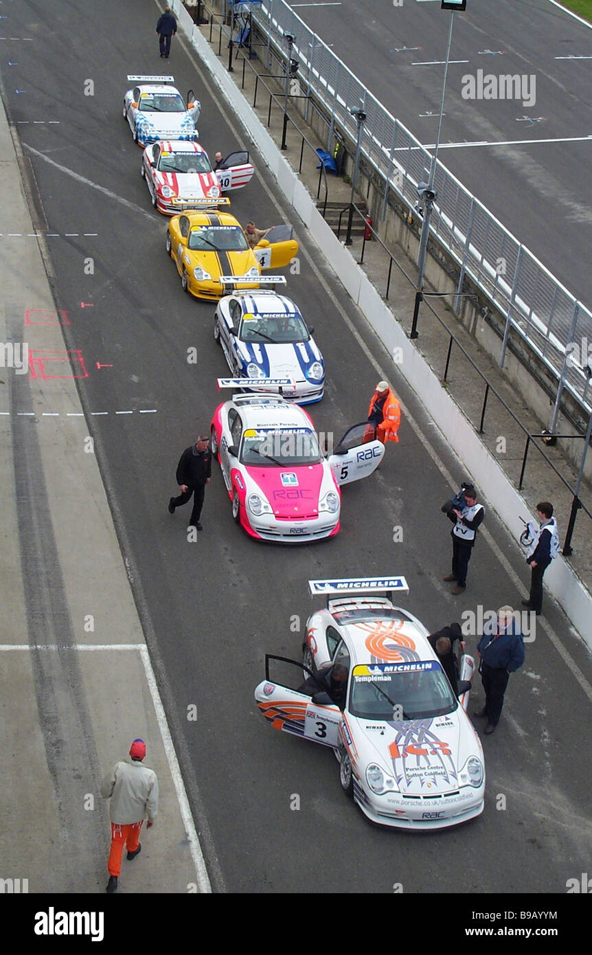 British touring cars lined up in the pit lane at Brands hatch Stock