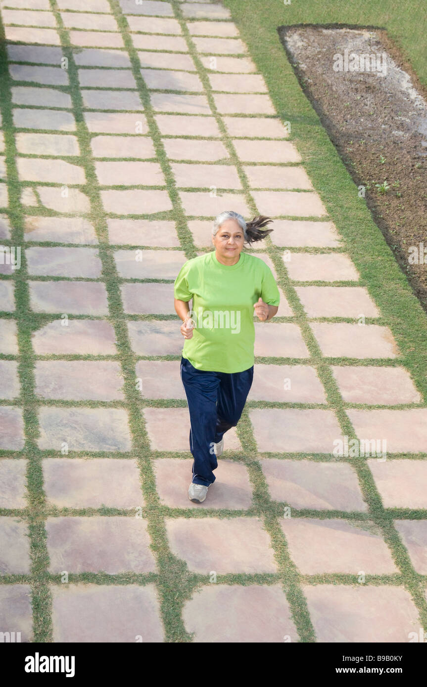 Woman jogging in a park, New Delhi, India Stock Photo Alamy