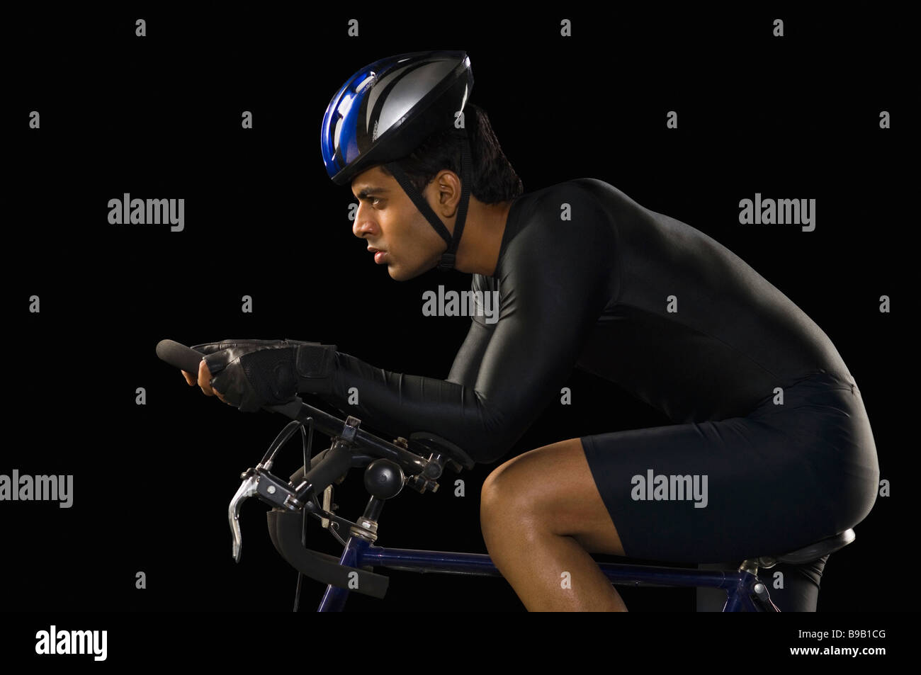 Male cyclist riding a racing bicycle Stock Photo