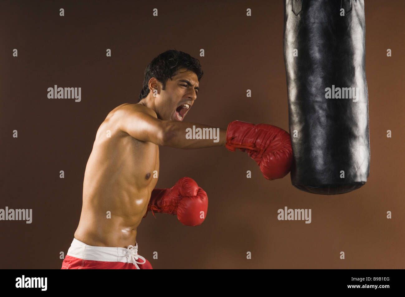 Male boxer showing aggression during practice Stock Photo Alamy