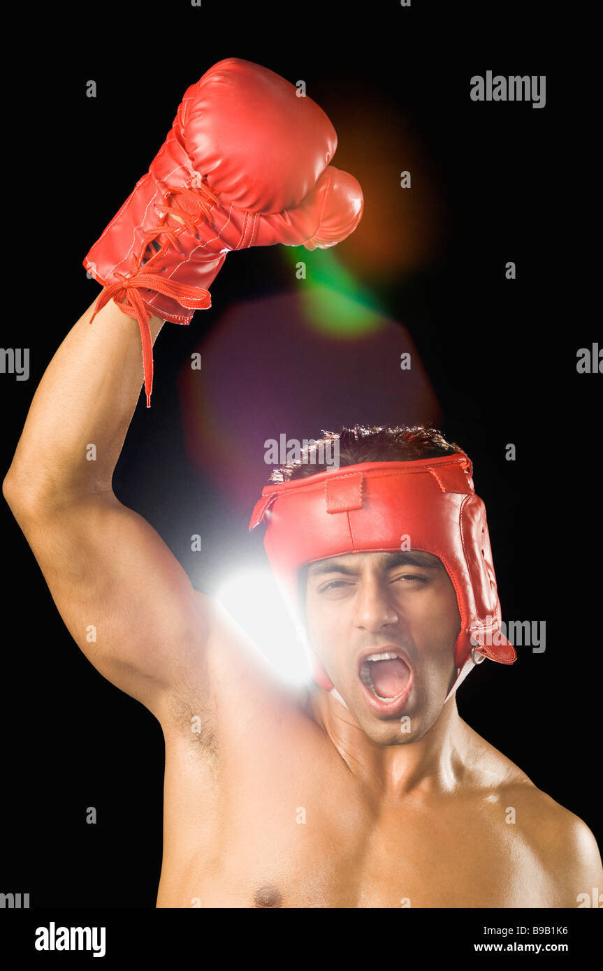 Boxer with his arms raised Stock Photo Alamy