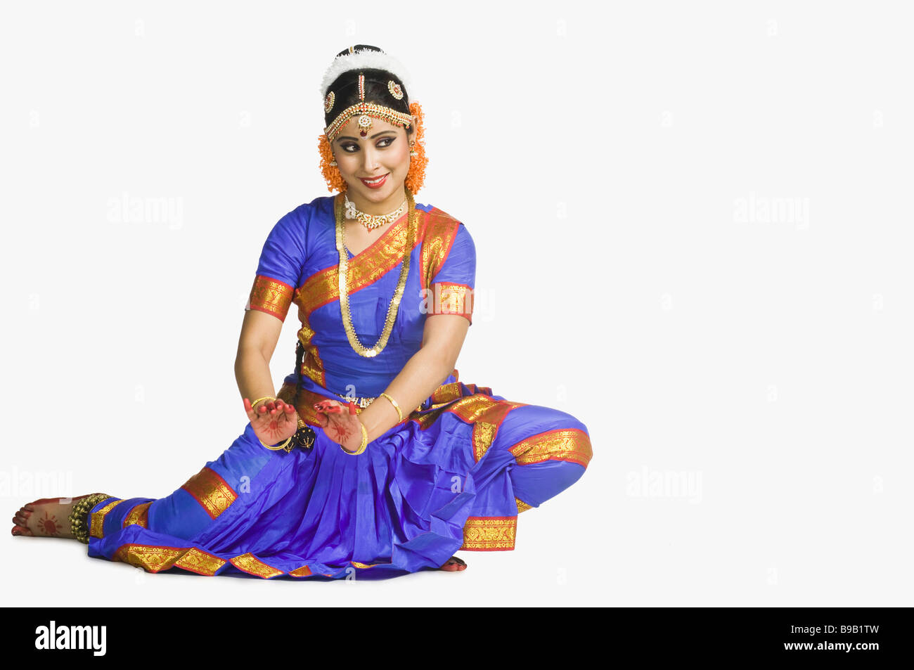 Woman performing Sarpa Sirsa of Bharatnatyam Stock Photo