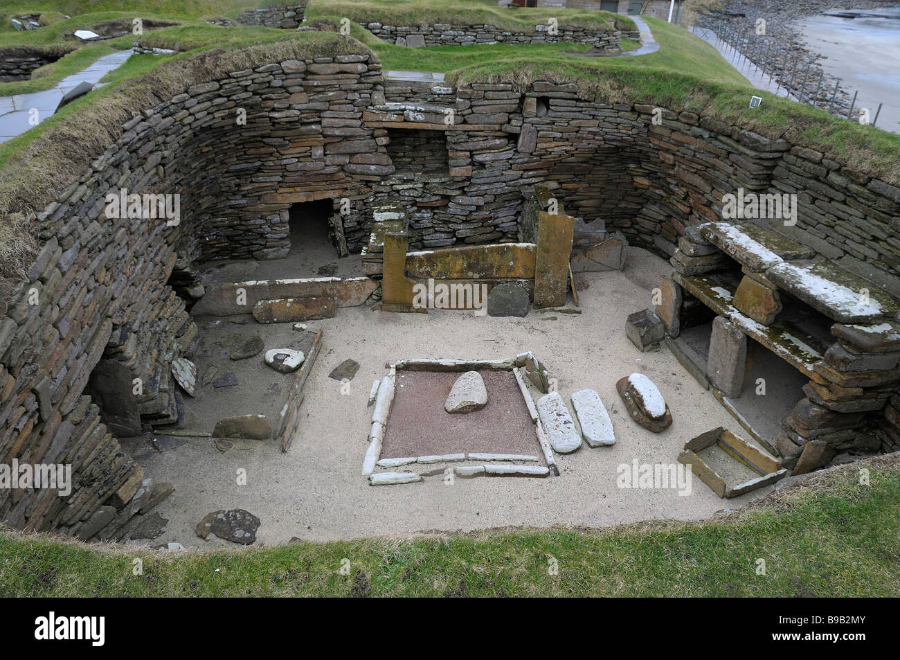 One of the ancient roundhouses excavated at Skara Brae, Orkney, Scotland. Stock Photo