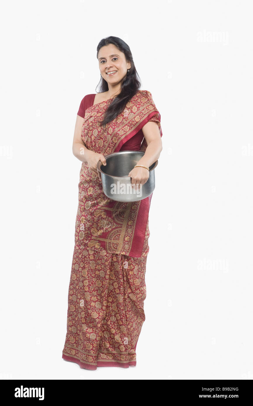 Woman holding a saucepan Stock Photo