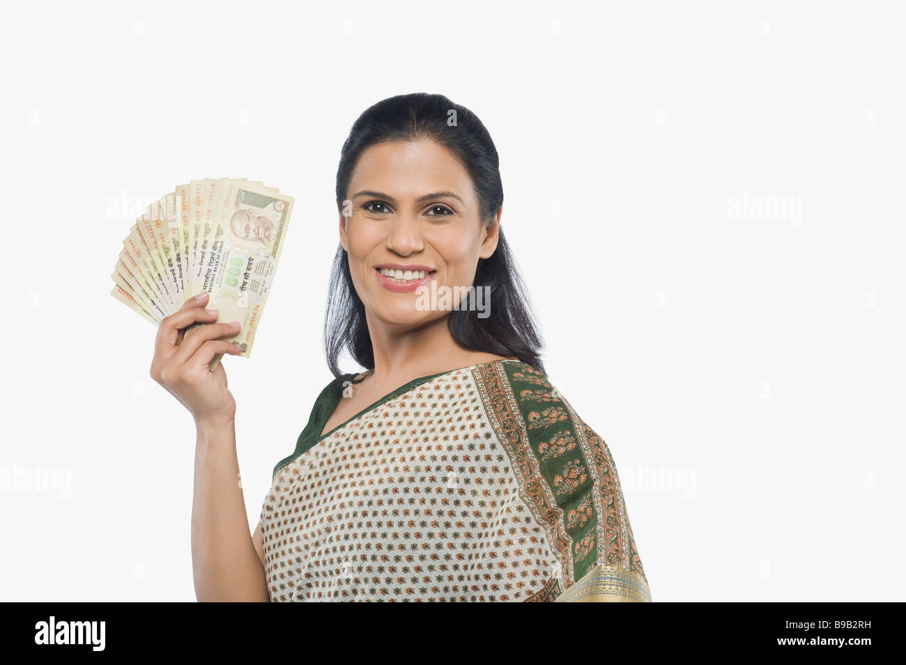 Woman holding currency notes Stock Photo