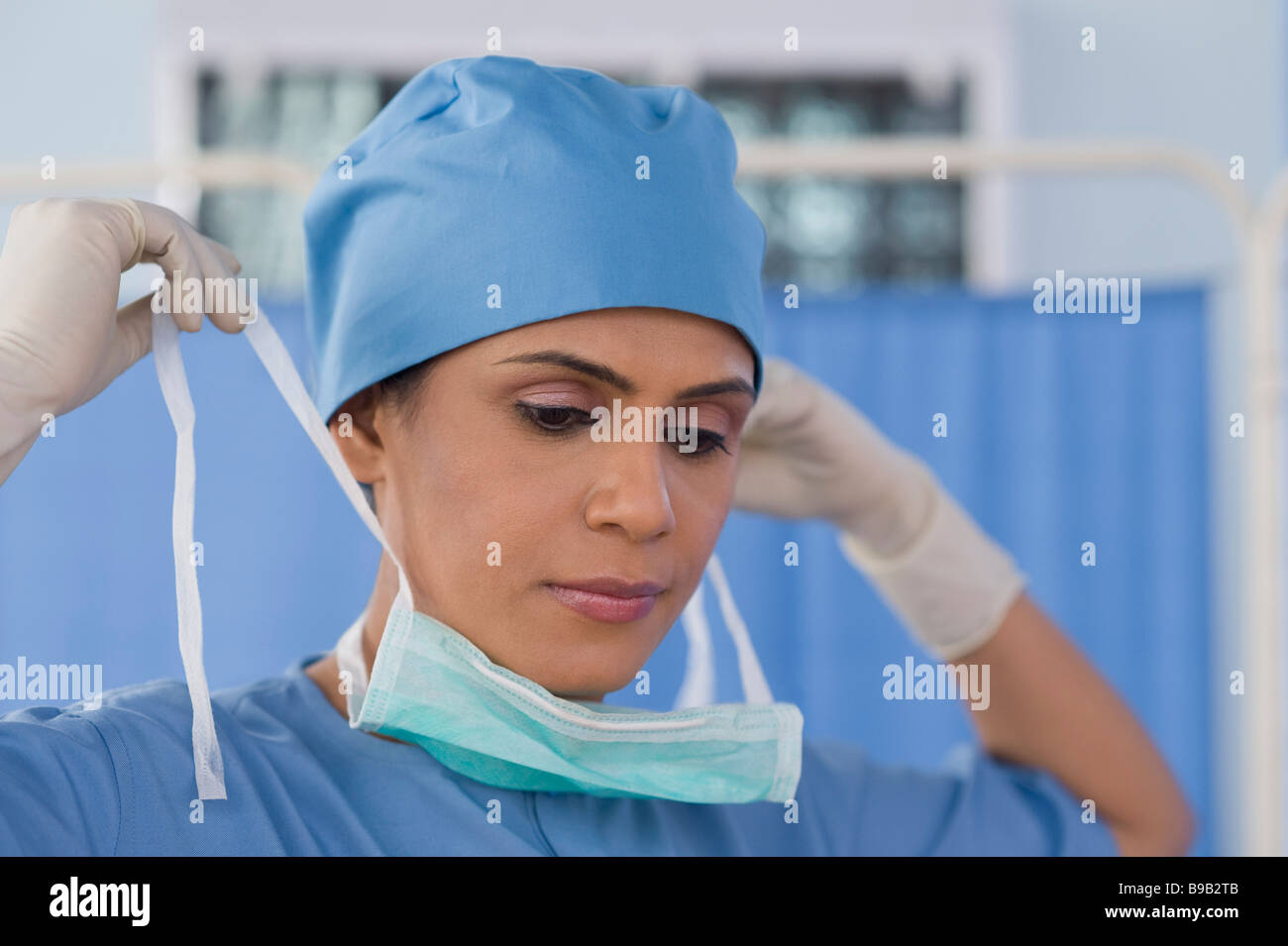 Female surgeon wearing a surgical mask Stock Photo Alamy