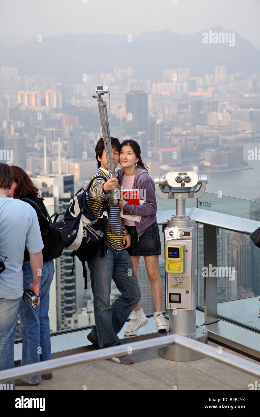 Tourists taking souvenir pictures from Hong Kong, China Stock Photo