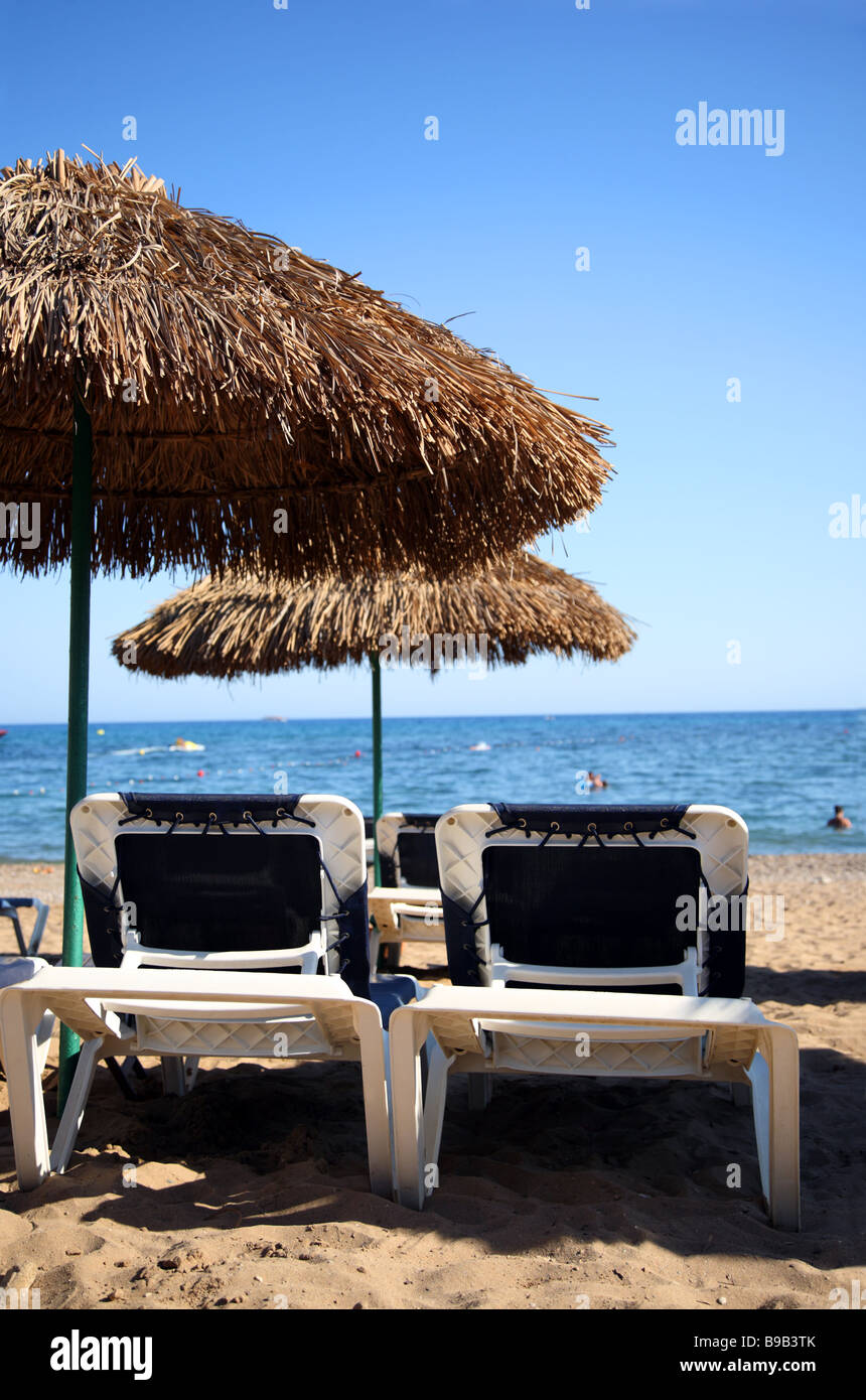 Sunbed under a beach umbrella Stock Photo Alamy