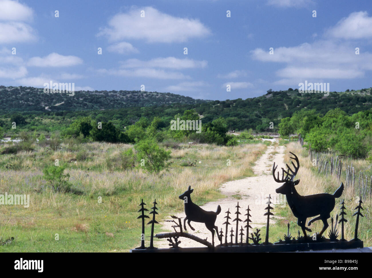 Wrought iron sign at ranch entrance near Bracketville on FM 334 highway at Edwards Plateau in Kinney County Texas USA Stock Photo