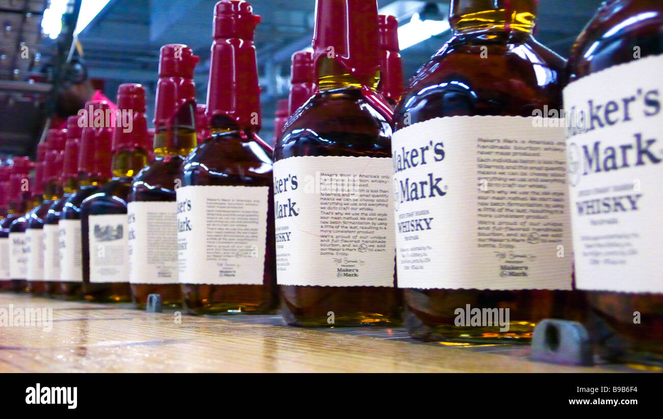 Red wax top bourbon bottles on production line Maker's Mark Distillery Loretto Kentucky USA Stock Photo