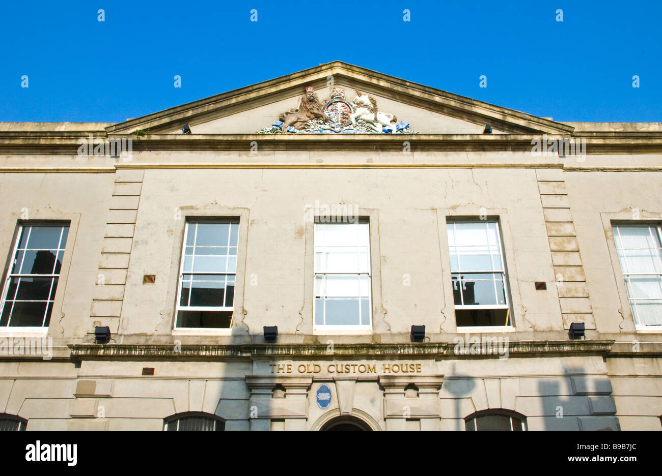 The Old Custom House, with coat of arms, converted into modern offices in Newport South Wales UK Stock Photo