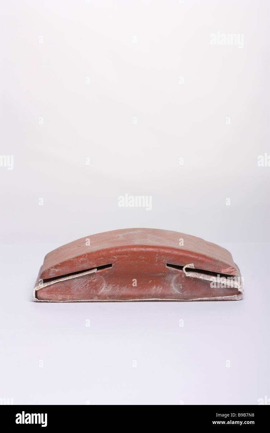 Red rubber used sanding block with sandpaper attached Stock Photo Alamy