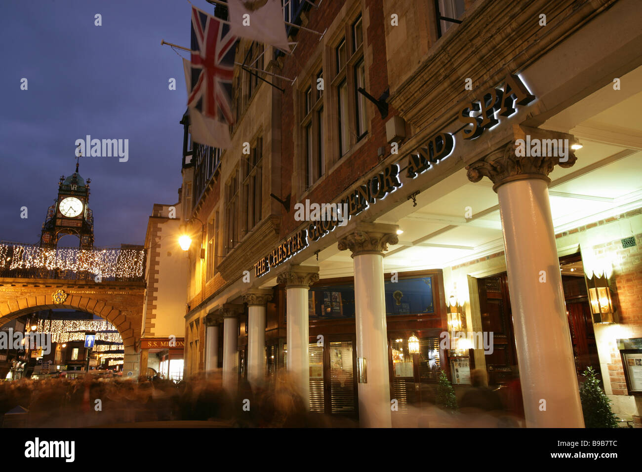 City of Chester, England. Night view of the five star Chester Grosvenor and Spa hotel with the Eastgate in the background. Stock Photo
