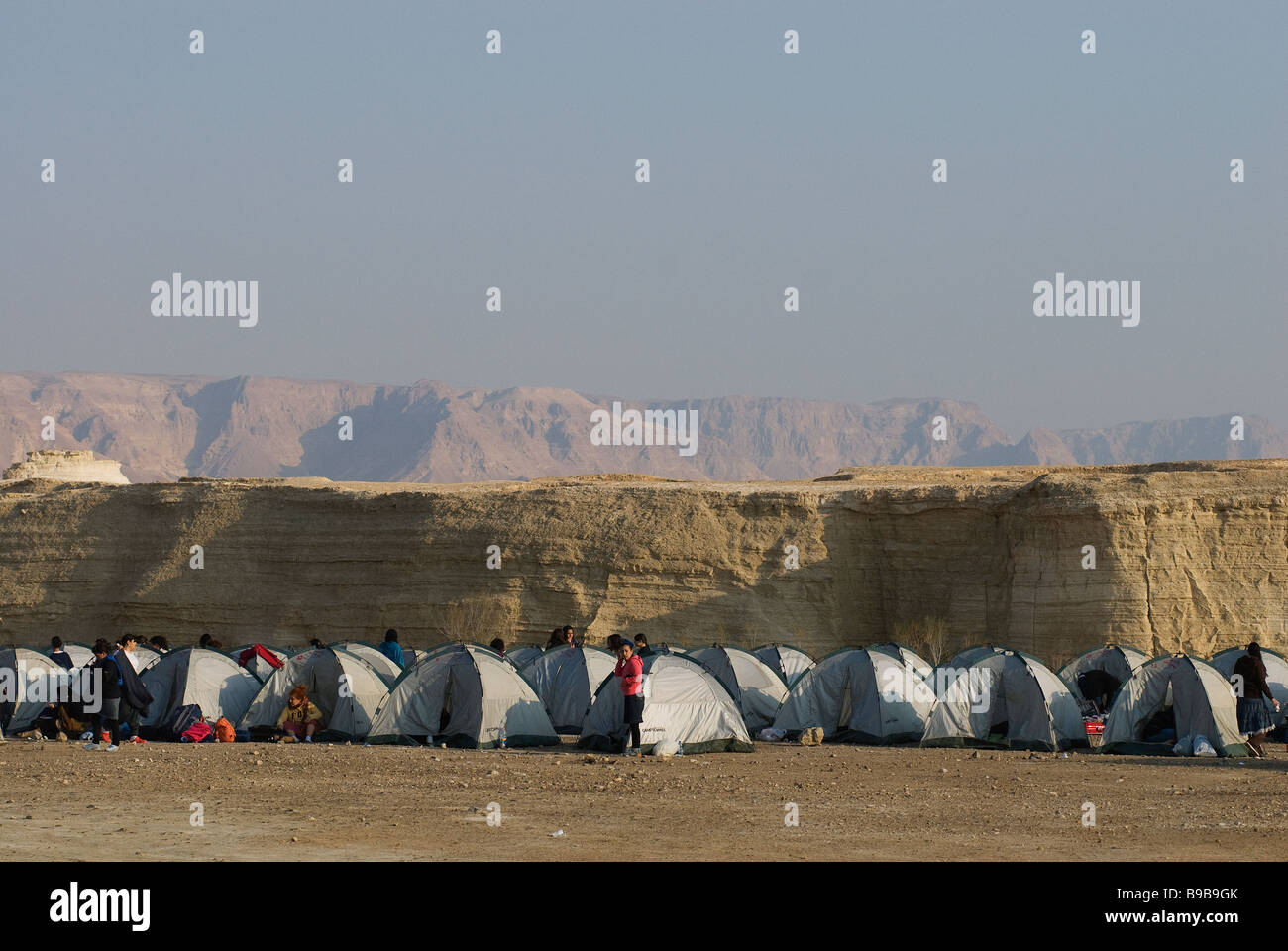 Hikers line up tents in the Judaean or Judean desert near Dead Sea Israel Stock Photo