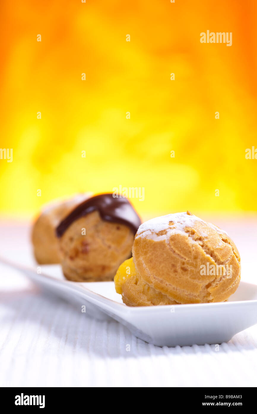 Puff pastry balls filled with vanilla chantilly and chocolate cream