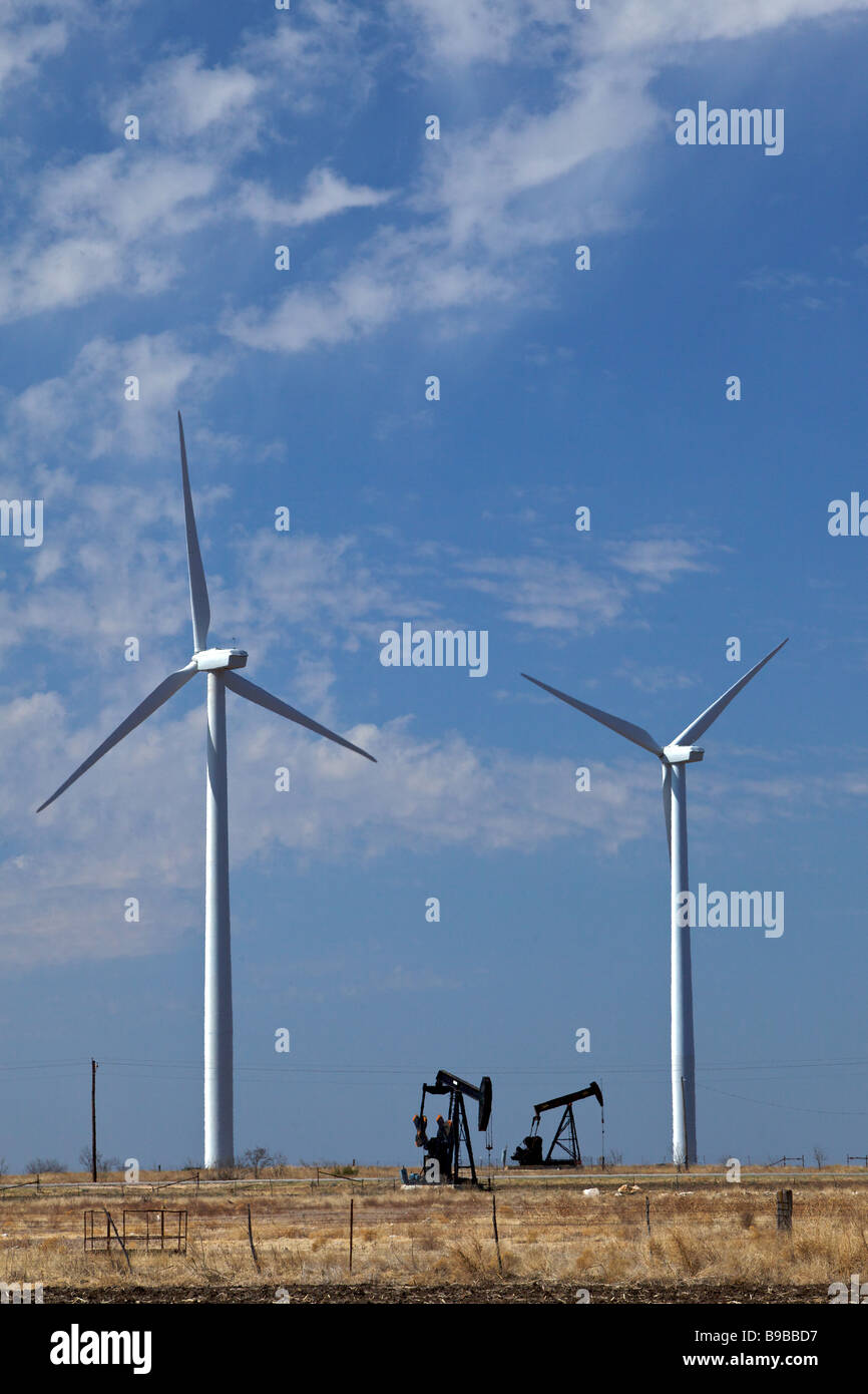 Wind turbines generating electricity at Horse Hollow Wind Farm Nolan Texas next to oil wells. Stock Photo
