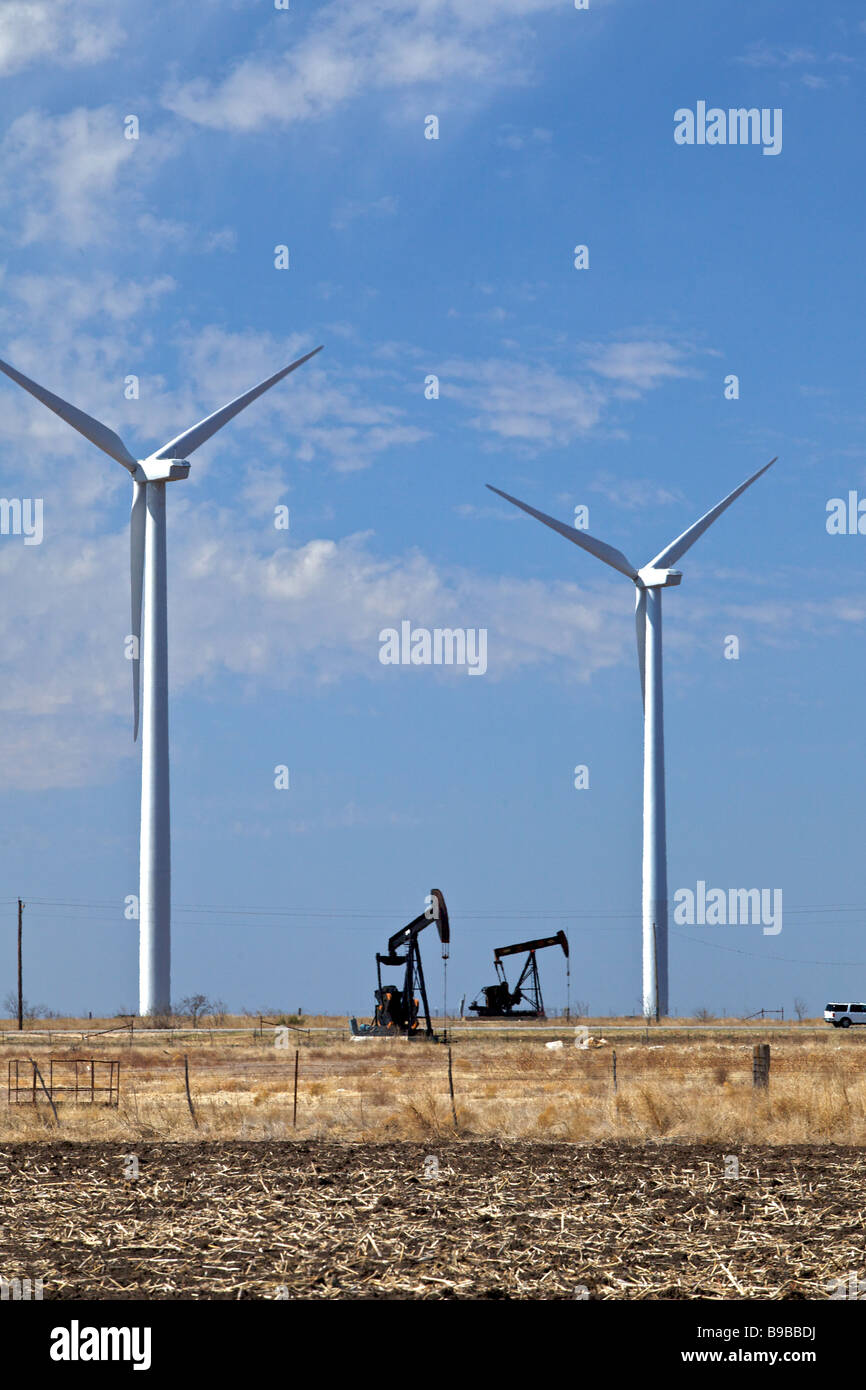 Wind turbines generating electricity at Horse Hollow Wind Farm Nolan Texas next to oil wells. Stock Photo