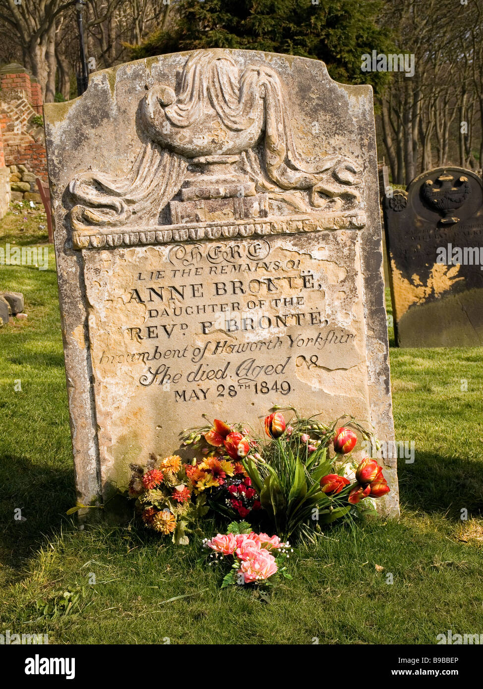 Gravestone marking the burial place of famous author Anne Bronte in St Marys churchyard Scarborough North Yorkshire Stock Photo