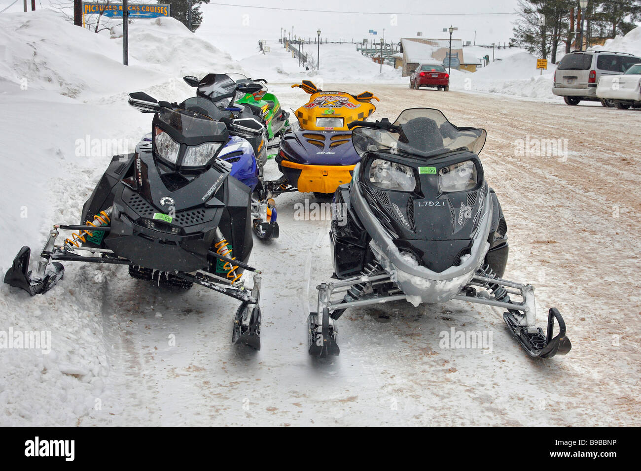 City Hall building in Munising Michigan USA  American snowmobiles parked on the street in MI USA nobody US lifestyle daily life hi-res Stock Photo