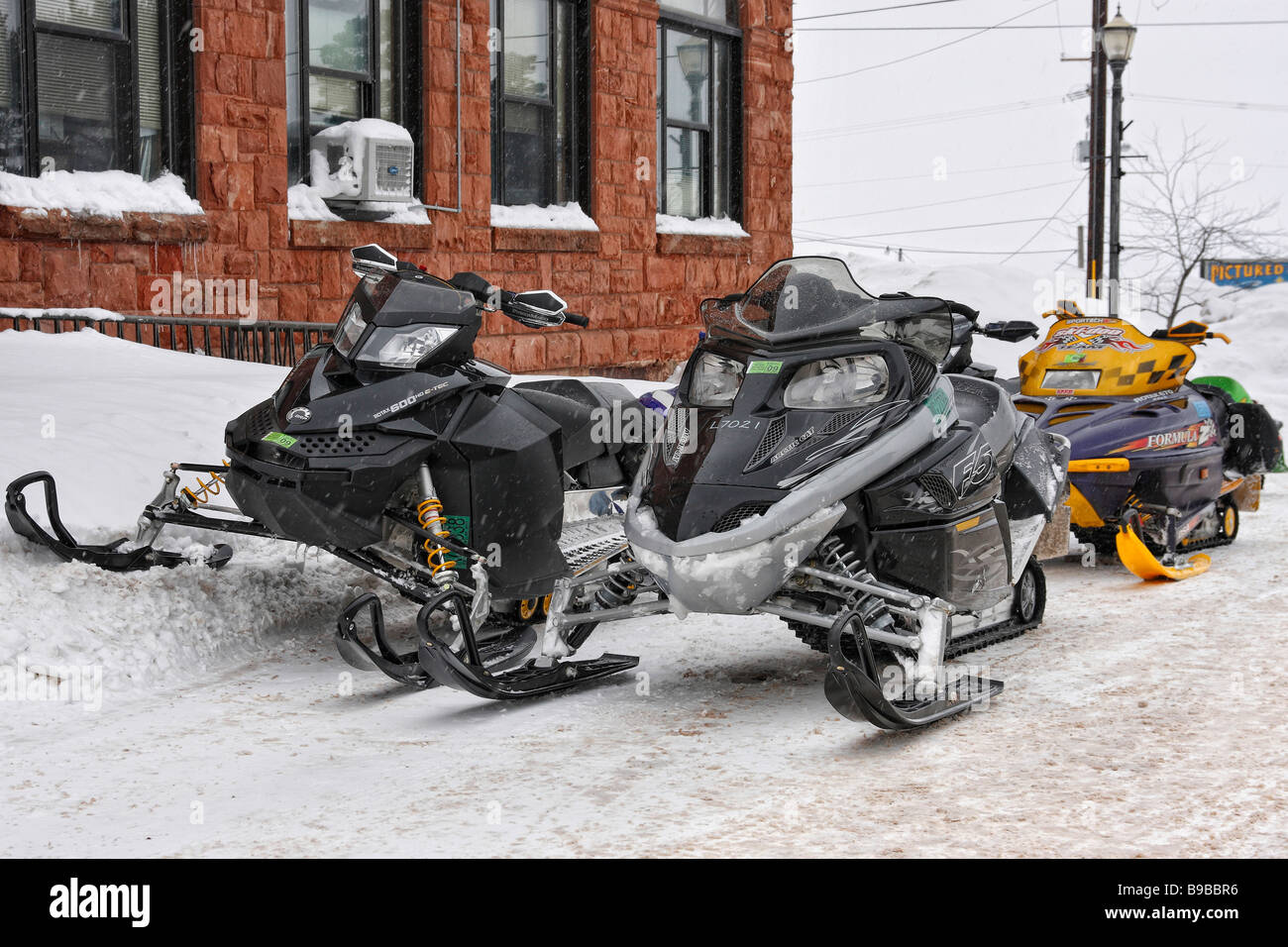 City Hall building in Munising Michigan USA  American snowmobiles parked on the street in MI USA US  lifestyle daily life hi-res nobody none hi-res Stock Photo