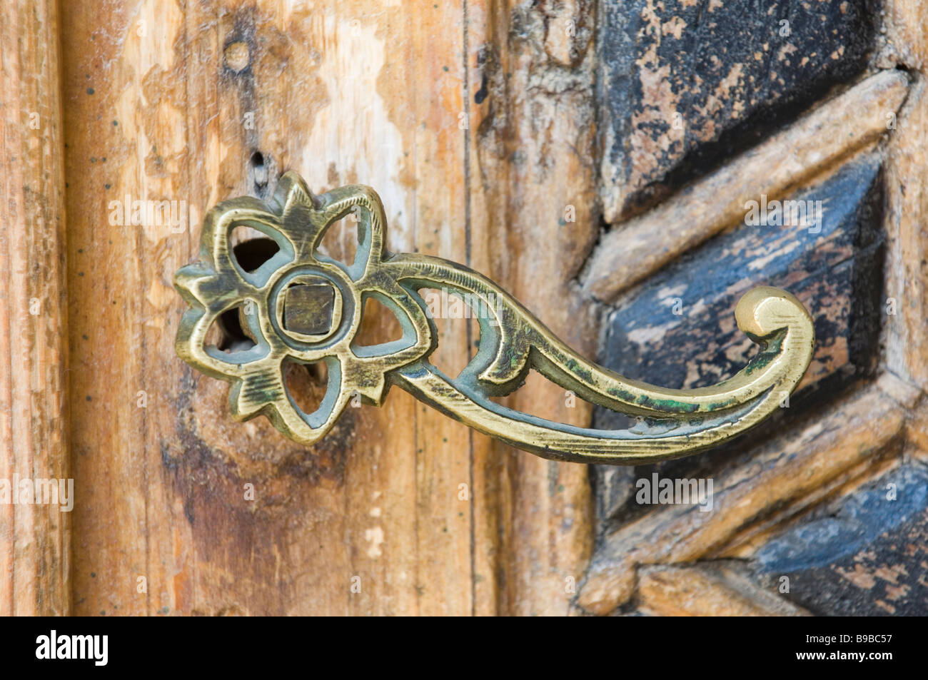 Ornate brass handle on an old wooden door Beiteddine Lebanon Middle