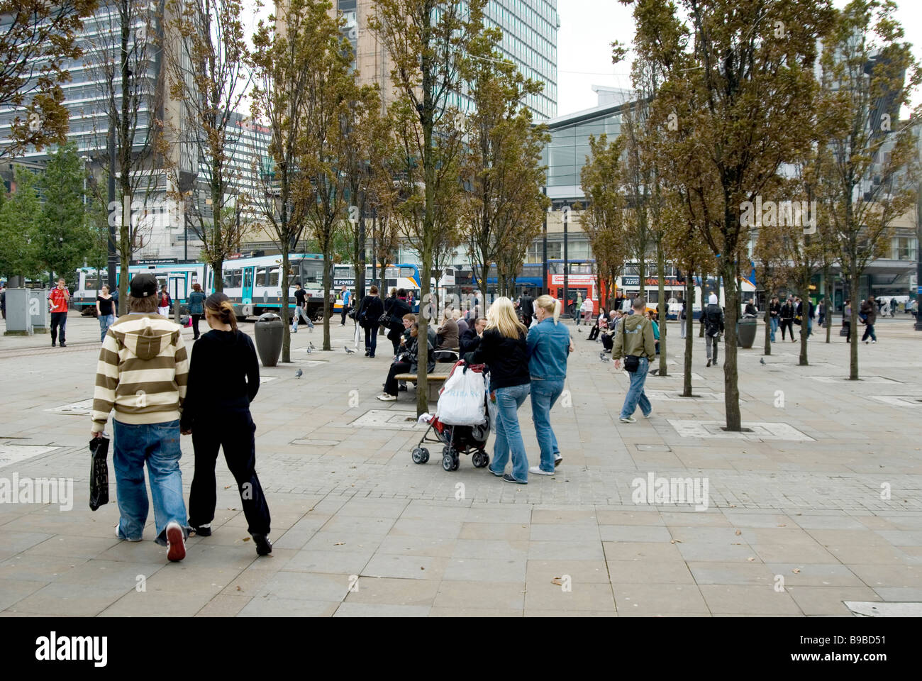 People walking in Piccadilly Gardens Manchester city centre UK Stock Photo