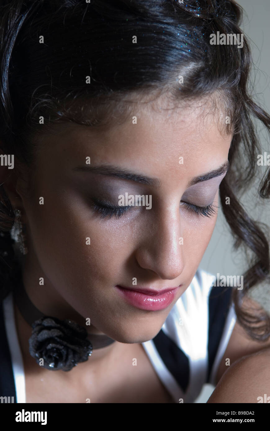 Close up of a young woman wearing make up and eyes closed Stock Photo
