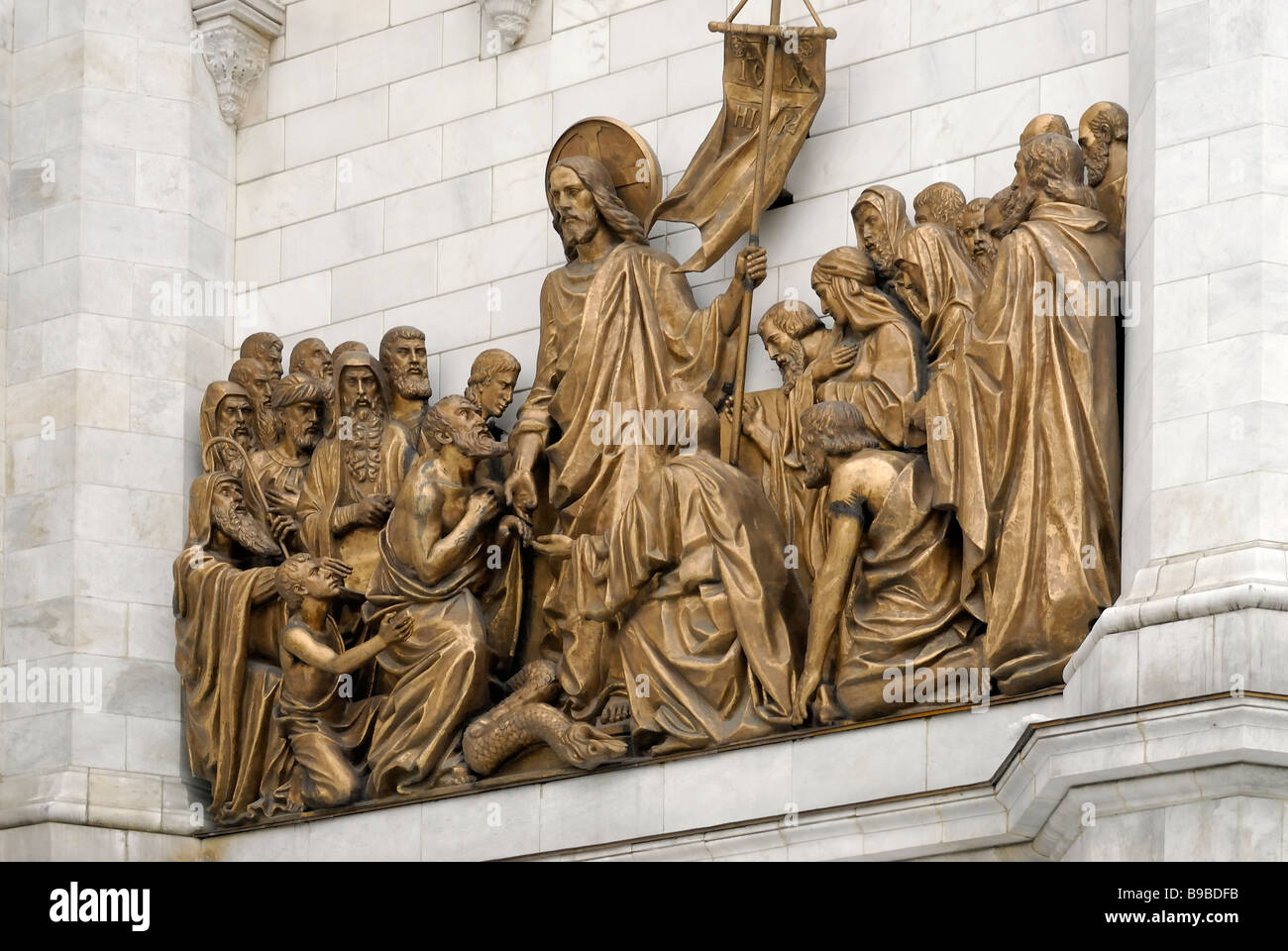 Fragment of facade with high reliefs of the Bible life scenes Cathedral of Christ the Saviour Stock Photo