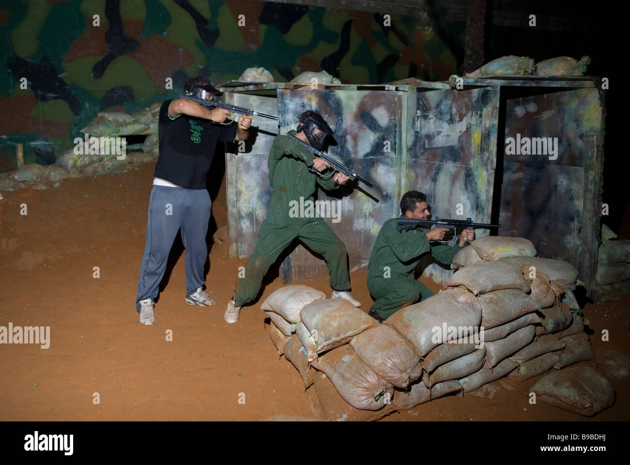Three young men playing paintball Beirut Lebanon Middle East Stock