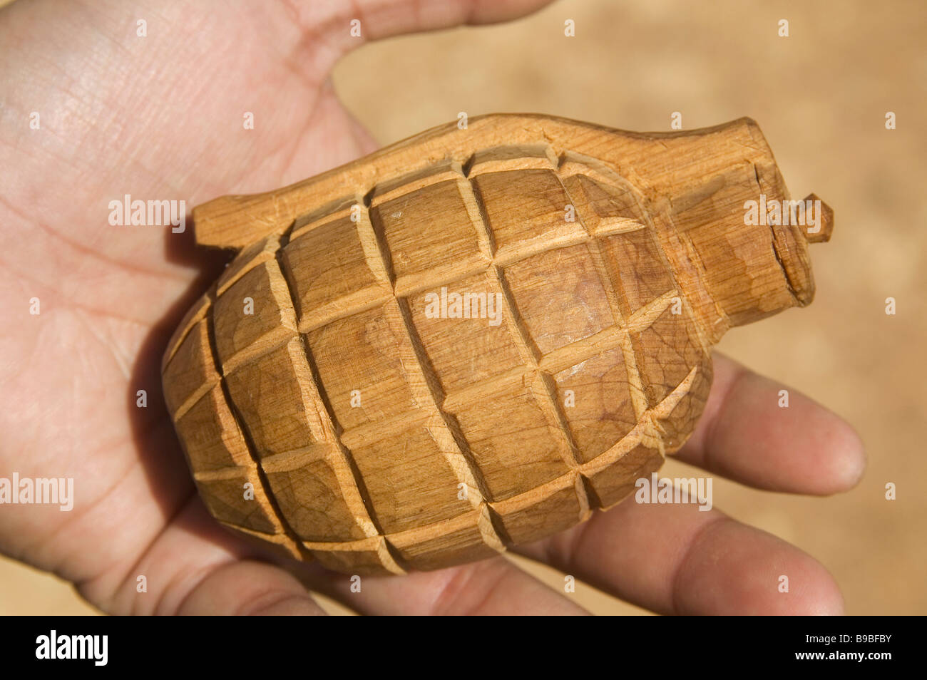 A wooden hand grenade where Bombs converted to other uses left over from the US and Vietnamese secret war in Phonsavan Laos Stock Photo