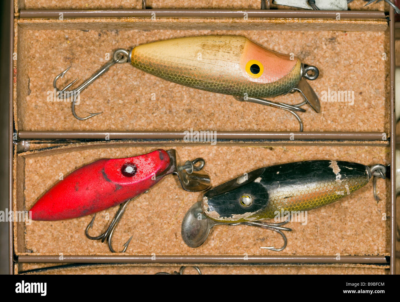Three fishing lures in a tackle box Stock Photo - Alamy