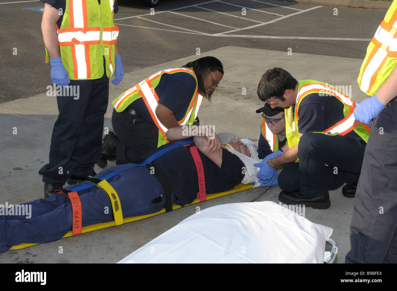 rescuers bandage an injured man Stock Photo