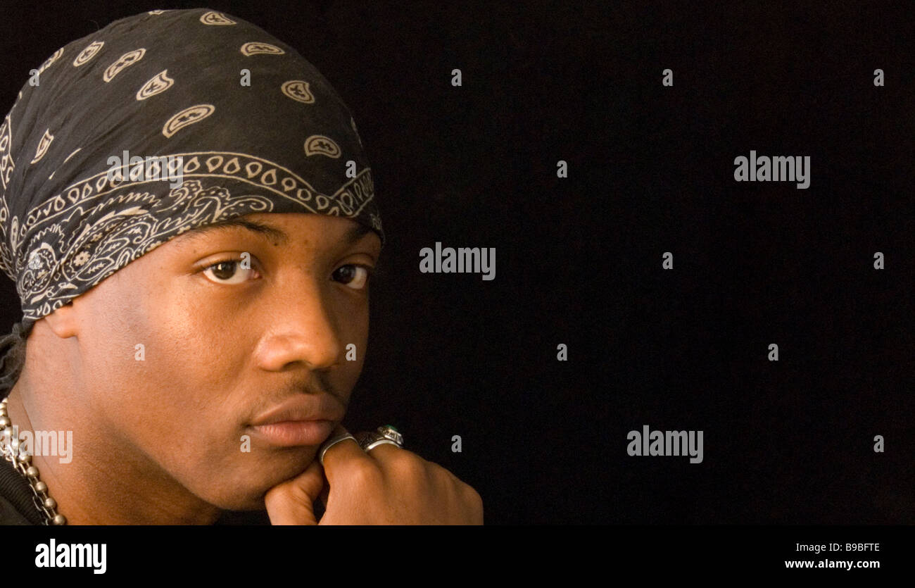 Young black man, with a bandanna and rings. Stock Photo