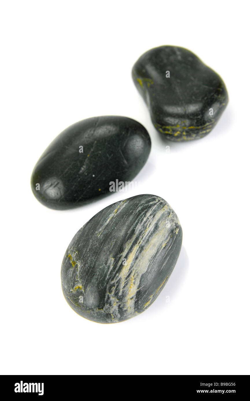 Black river rocks isolated against a white background Stock Photo