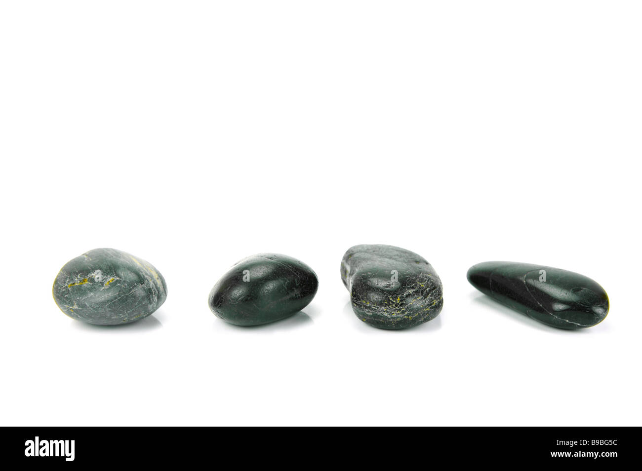 Black river rocks isolated against a white background Stock Photo