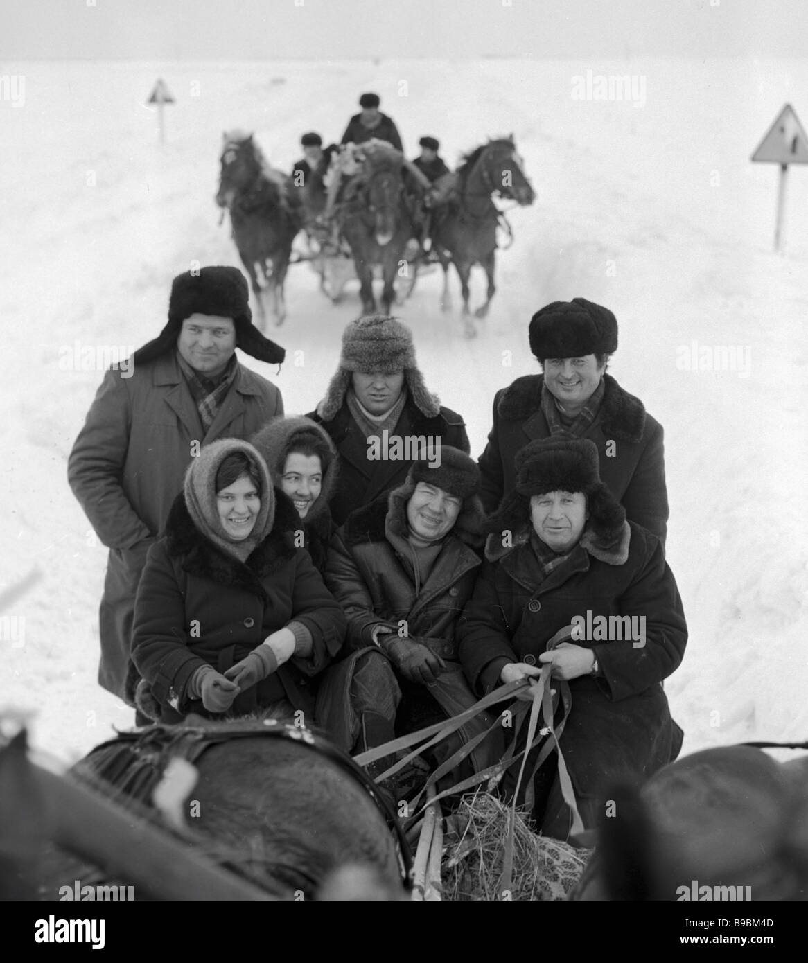 Well known Soviet poet Andrei Voznesensky center riding in a troika in ...