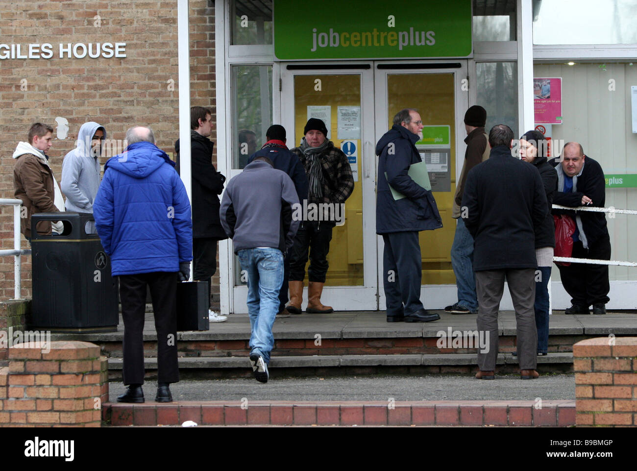 UNEMPLOYED QUEUEING JOB CENTRE PLUS FOR JOBS Stock Photo