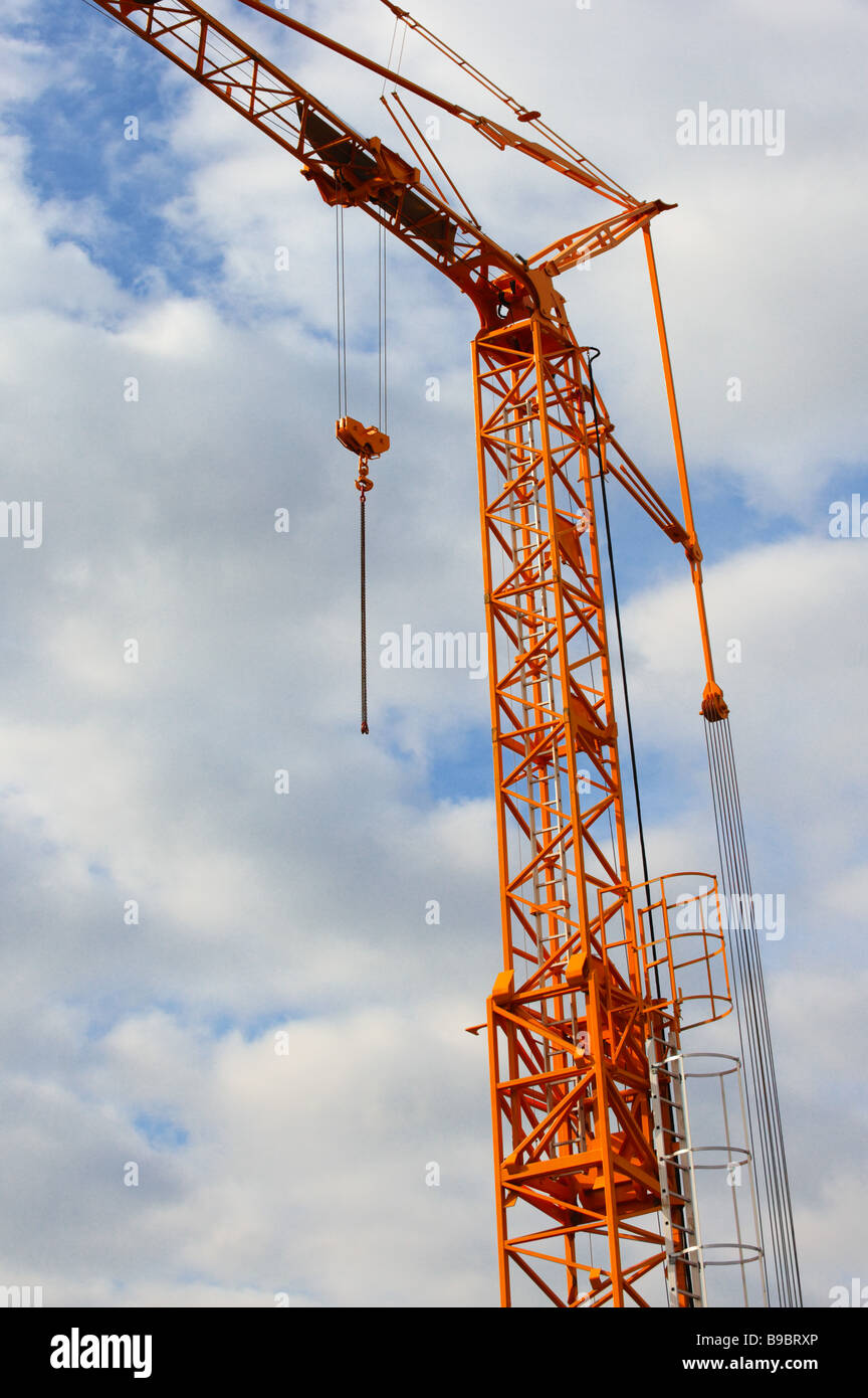The yellow crane on the background of blue sky Stock Photo