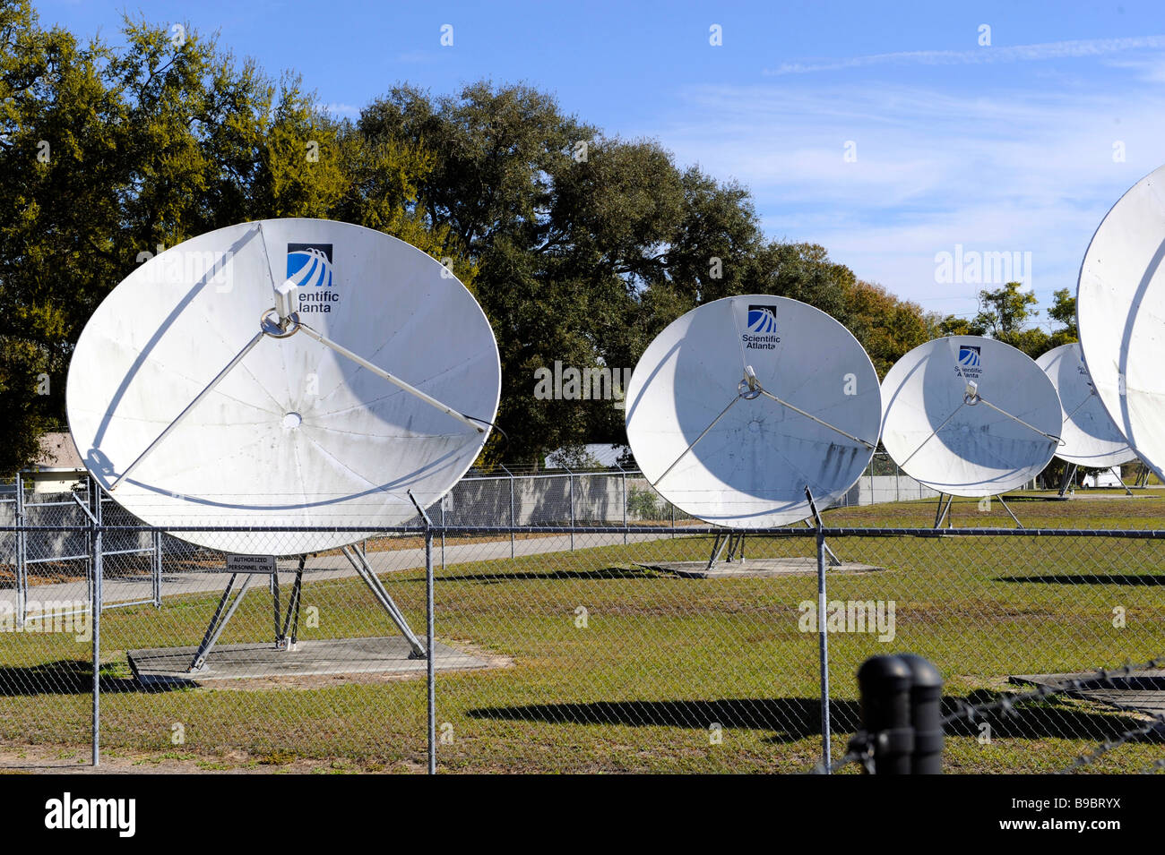 Satellite dishes transmit television signal to subscribers Stock Photo